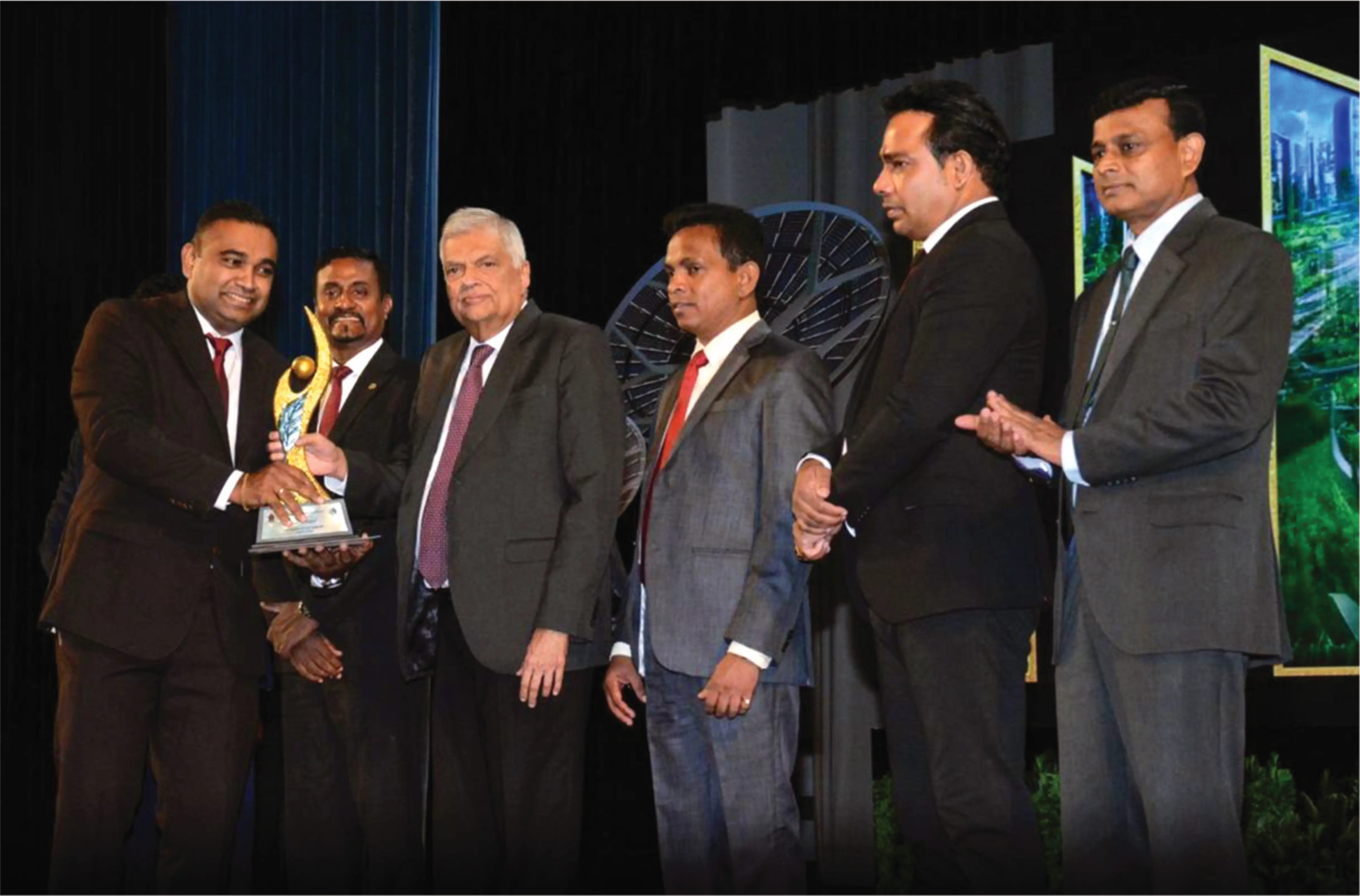 A member of hirdarami company collecting the award for presidential environmental awards 2024